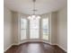 Charming dining nook featuring bay windows, filling the space with light and style at 6528 Carriage Ln, Stone Mountain, GA 30087