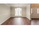 Spacious dining room with natural light and a classic chandelier fixture at 6528 Carriage Ln, Stone Mountain, GA 30087