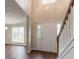 Bright entryway with a staircase and views into the living room offering a spacious welcome at 6528 Carriage Ln, Stone Mountain, GA 30087