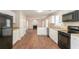Open kitchen flowing into the living area, featuring modern appliances and ample counter space at 6528 Carriage Ln, Stone Mountain, GA 30087