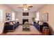 Cozy living room features a fireplace, plush seating, and ample natural light at 6528 Carriage Ln, Stone Mountain, GA 30087
