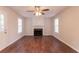 Bright living room featuring a fireplace and two windows providing lots of natural light at 6528 Carriage Ln, Stone Mountain, GA 30087