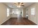 Open living space with hardwood floors and a view of the kitchen at 6528 Carriage Ln, Stone Mountain, GA 30087