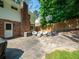 Inviting backyard featuring a brick home exterior, patio with furniture, and a basketball hoop for outdoor fun at 1373 Brawley Ne Cir, Brookhaven, GA 30319