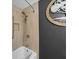Updated bathroom featuring a tub with tile surround, a shower bar, and decorative tree on the wall at 1373 Brawley Ne Cir, Brookhaven, GA 30319