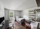 Inviting bedroom featuring a cozy bed, desk, natural light, and modern decor at 1373 Brawley Ne Cir, Brookhaven, GA 30319