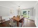 Elegant dining room with a wooden table, chandelier, and bright natural light at 1373 Brawley Ne Cir, Brookhaven, GA 30319