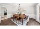 Elegant dining room with a wooden table, chandelier, and bright natural light at 1373 Brawley Ne Cir, Brookhaven, GA 30319
