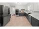 Spacious kitchen with white cabinets, stainless steel appliances, and modern finishes at 1373 Brawley Ne Cir, Brookhaven, GA 30319