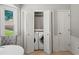 Convenient laundry area with bi-fold doors, modern washer, and dryer at 1373 Brawley Ne Cir, Brookhaven, GA 30319