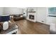Comfortable living room with fireplace, hardwood floors, ample seating, and natural light at 1373 Brawley Ne Cir, Brookhaven, GA 30319
