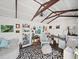 Shed interior with stylish decor, including an area rug, furnishings, and artwork, creating an inviting creative space at 1373 Brawley Ne Cir, Brookhaven, GA 30319