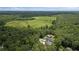 An aerial view of the property nestled among lush greenery and surrounding trees at 2490 S Carroll S St, Villa Rica, GA 30180