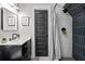 Modern bathroom with dark vanity, shower with modern tile, and stylish decor at 2490 S Carroll S St, Villa Rica, GA 30180