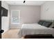 Serene bedroom with hardwood floors, minimalist decor, and a comfy bed at 2490 S Carroll S St, Villa Rica, GA 30180