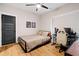 Cozy bedroom with a gaming setup, wood floors, and minimalist decor at 2490 S Carroll S St, Villa Rica, GA 30180