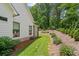 Well-maintained home exterior with stone accents and beautifully landscaped yard at 2490 S Carroll S St, Villa Rica, GA 30180