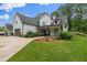 Attractive front yard with lush green lawn and well-maintained landscaping leading to the charming home at 2490 S Carroll S St, Villa Rica, GA 30180