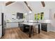Bright kitchen featuring a center island, white cabinetry, stainless steel appliances, and natural light at 2490 S Carroll S St, Villa Rica, GA 30180