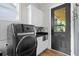 Modern laundry room featuring a front-load washer, stylish cabinets, and a sink at 2490 S Carroll S St, Villa Rica, GA 30180