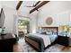 Serene main bedroom with vaulted ceiling, exposed beams, and access to outdoor patio at 2490 S Carroll S St, Villa Rica, GA 30180