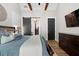 Comfortable bedroom featuring exposed wood beams, barn door, and modern decor at 2490 S Carroll S St, Villa Rica, GA 30180