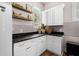 Stylish mudroom featuring white cabinetry, granite countertops, and a convenient window for natural light at 2490 S Carroll S St, Villa Rica, GA 30180