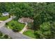 Charming ranch-style home nestled among mature trees with a well-maintained front yard and inviting curb appeal at 3833 Paddington Trail, Rex, GA 30273