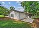 View of home's backyard with patio and siding at 3833 Paddington Trail, Rex, GA 30273