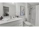 Clean bathroom with shower, toilet, sink, and decorative mirror at 3833 Paddington Trail, Rex, GA 30273