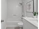 Clean bathroom featuring a shower-tub combo and an elongated toilet seat at 3833 Paddington Trail, Rex, GA 30273