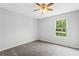 An empty bedroom is brightly lit by the daylight coming through the window at 3833 Paddington Trail, Rex, GA 30273