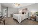 Cozy bedroom featuring a ceiling fan, a comfortable bed, and stylish decor at 3833 Paddington Trail, Rex, GA 30273