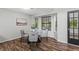Charming dining area with a round table and bay windows at 3833 Paddington Trail, Rex, GA 30273