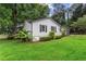 Charming single-story home featuring black shutters, a front porch, and an attached two-car garage at 3833 Paddington Trail, Rex, GA 30273