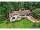 A charming home with a well-manicured lawn and a two-car garage at 3833 Paddington Trail, Rex, GA 30273