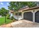 Charming home featuring black shutters, a covered front porch, and a two-car garage at 3833 Paddington Trail, Rex, GA 30273