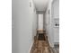 Hallway with updated floors leading to rooms of the house at 3833 Paddington Trail, Rex, GA 30273