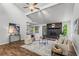 Bright living room with a stone fireplace, vaulted ceiling, and stylish decor at 3833 Paddington Trail, Rex, GA 30273