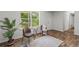 Bright sitting area with a large window and access to the outdoors at 3833 Paddington Trail, Rex, GA 30273