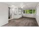 Sunroom with a ceiling fan, hardwood floors, and plenty of light at 3833 Paddington Trail, Rex, GA 30273