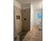 Modern bathroom featuring a tiled shower with river rock flooring at 4706 Piney Grove Rd, Cumming, GA 30040