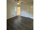 Bedroom featuring a ceiling fan, neutral paint, two large closets, and new flooring at 4706 Piney Grove Rd, Cumming, GA 30040