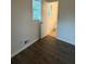 Bedroom showing the door to the updated bathroom at 4706 Piney Grove Rd, Cumming, GA 30040