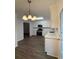 Updated kitchen featuring ample cabinetry, stainless appliances and stone countertops at 4706 Piney Grove Rd, Cumming, GA 30040