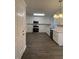 Modern kitchen featuring white cabinets, stainless steel appliances, and sleek countertops at 4706 Piney Grove Rd, Cumming, GA 30040