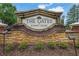 The Gates at Johns Creek community sign with stone and brick design at 7027 Walham Grv, Duluth, GA 30097
