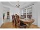 Elegant dining room featuring a large wooden table and ornate chairs, perfect for hosting gatherings and meals at 7027 Walham Grv, Duluth, GA 30097