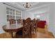 Elegant dining room featuring a large wooden table and ornate chairs, perfect for hosting gatherings and meals at 7027 Walham Grv, Duluth, GA 30097