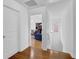 Hallway with hardwood floors leading to a home office at 7027 Walham Grv, Duluth, GA 30097